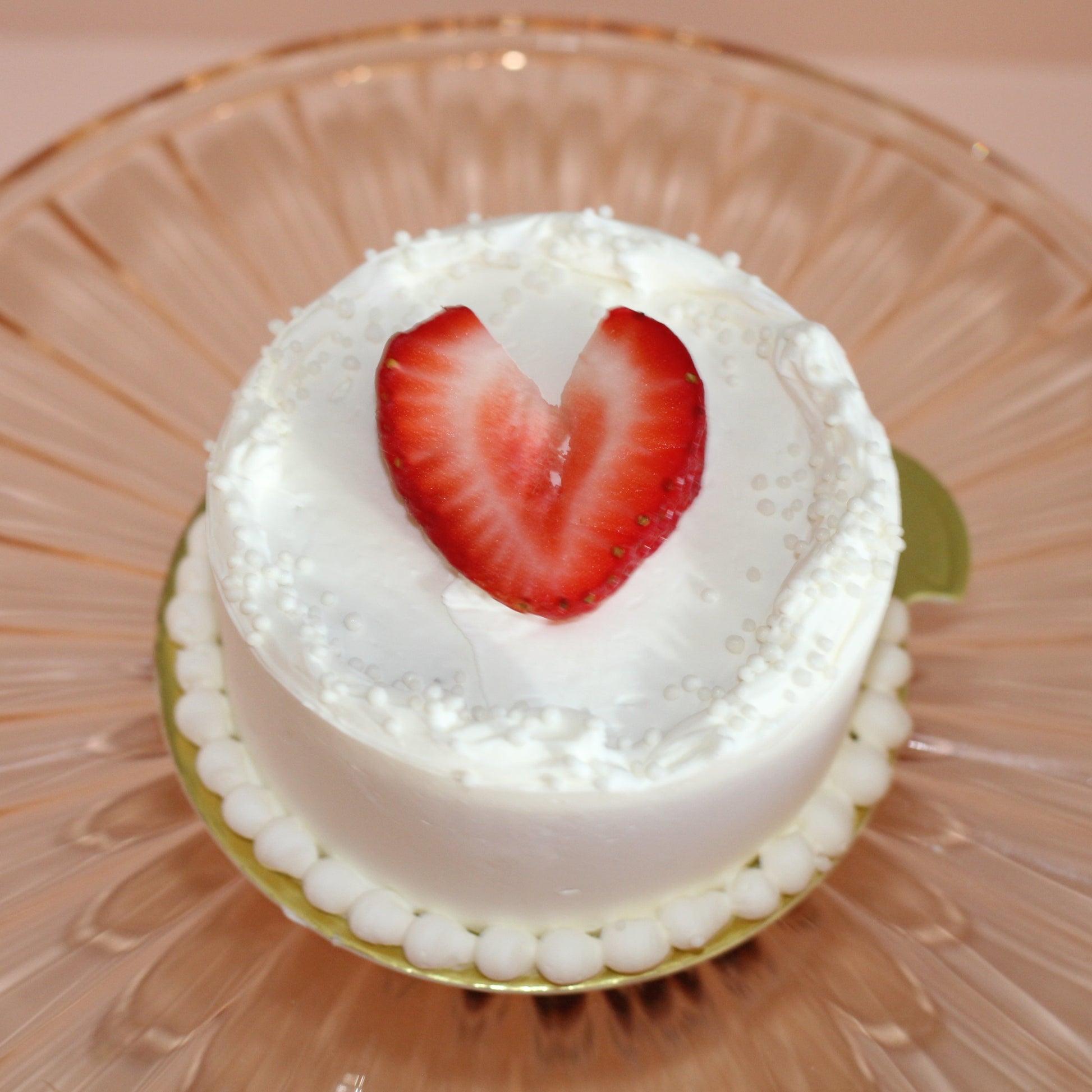 Vanilla Bean Cake with Fresh Strawberries, Topped with a strawberry shaped as a heart